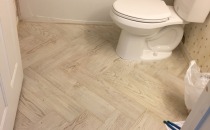 Hall Bath porcelain plank floor herringbone design